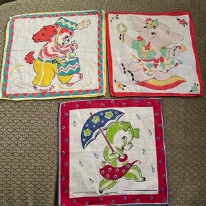 Vintage lot of three children’s cloth cartoon handkerchiefs.